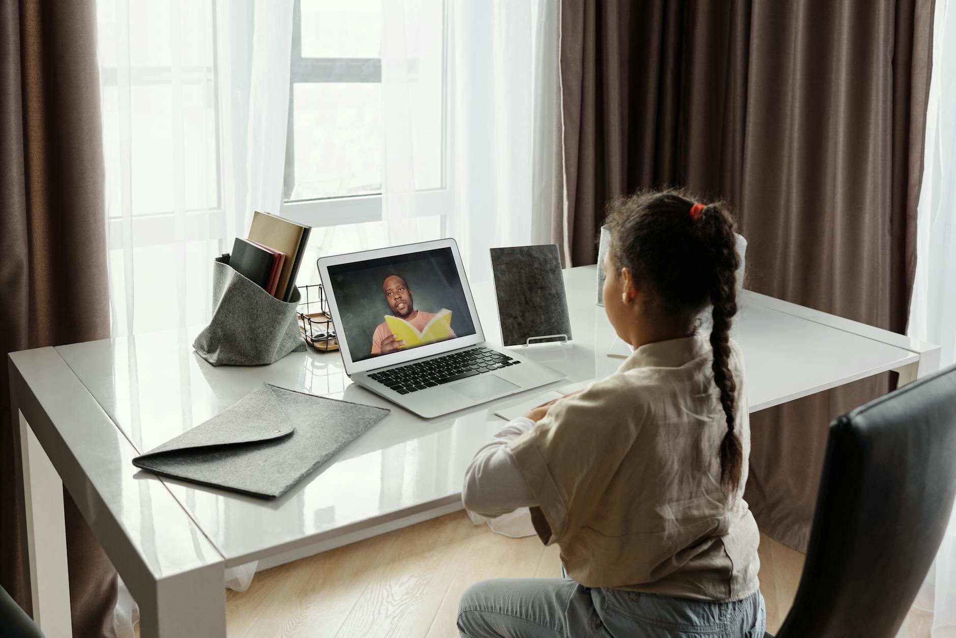 little girl taking online classes